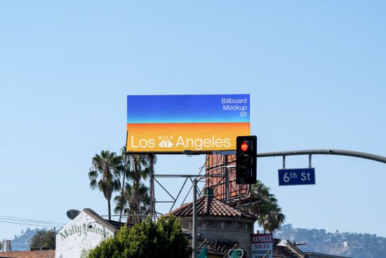 Billboard mockup with a colorful sunrise design and Los Angeles text displayed above urban scenery for advertising and design presentations.